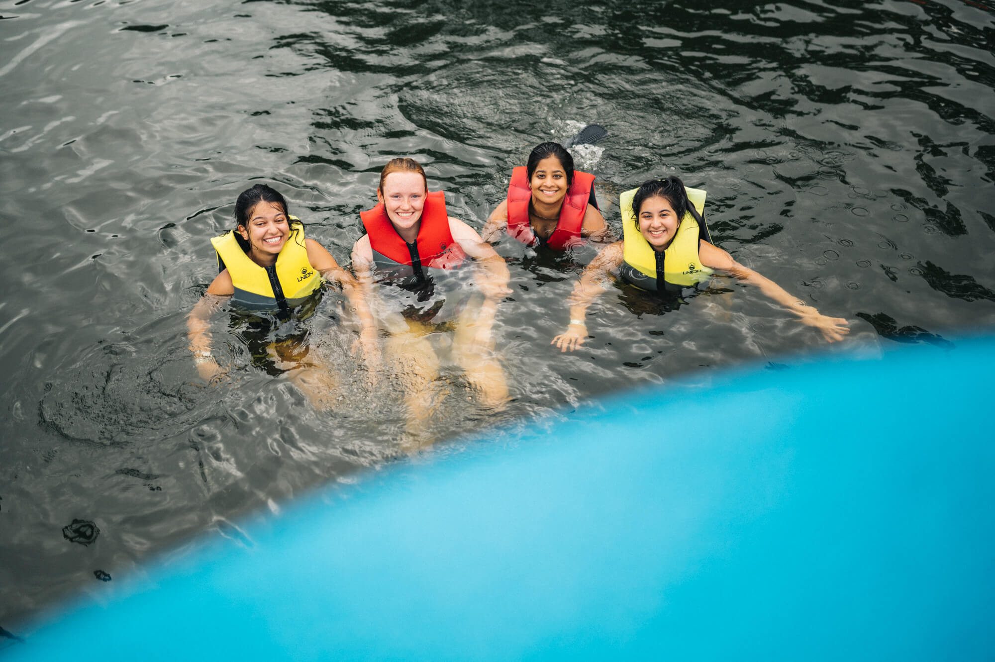 Four adults having fun on the aqua park